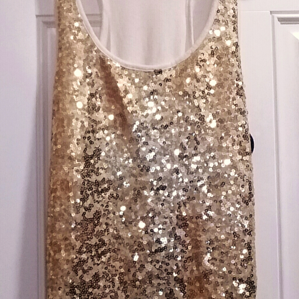 Color is YELLOW gold. M Guess sleeveless